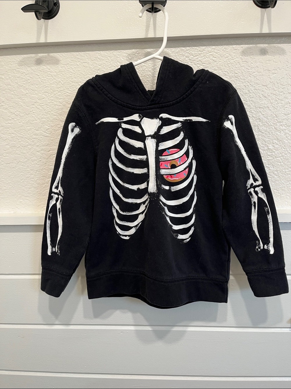 Old Navy Black Kids Hoodie with White Skeleton and Pink donut Graphic